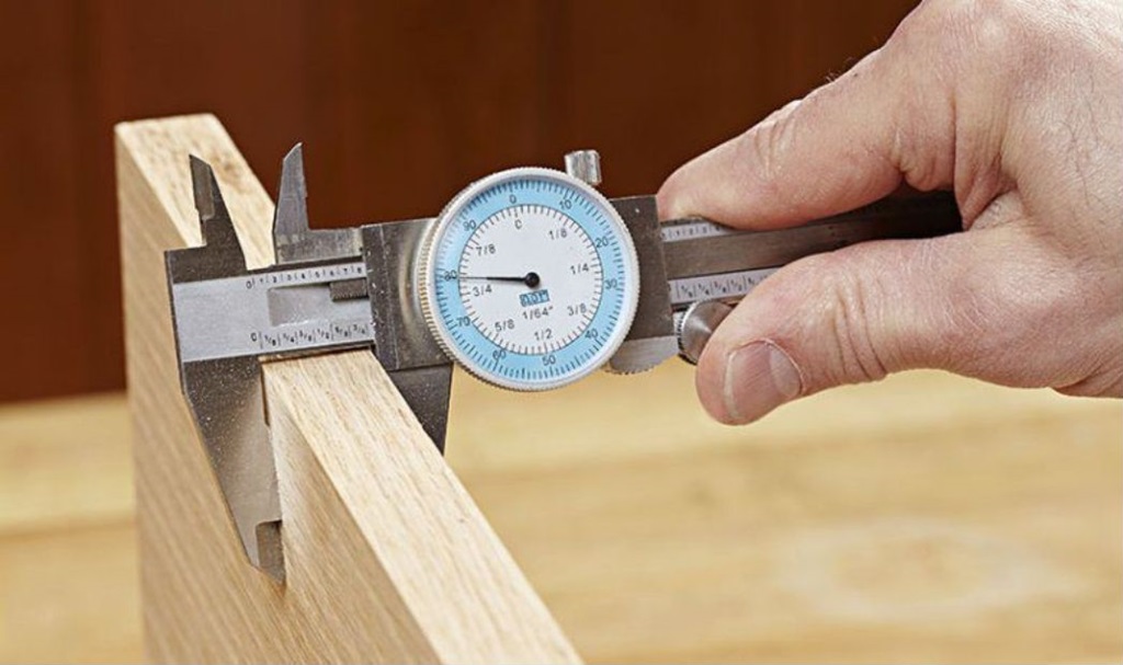 What is the accuracy of a dial caliper reading?