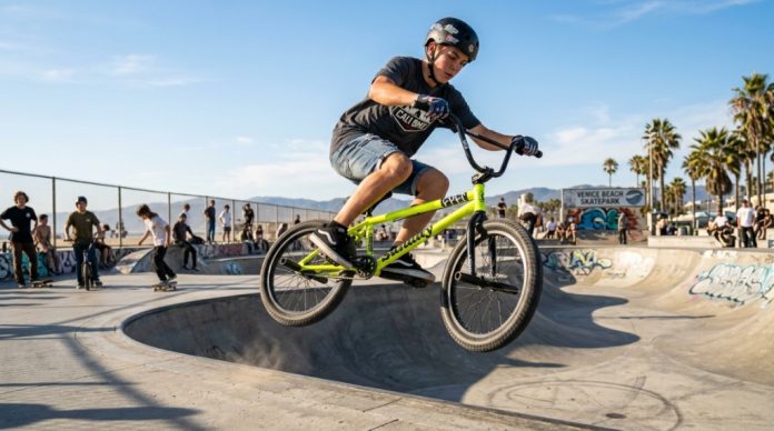 Mechanic adjusting handlebars and headset on a professional BMX bike.